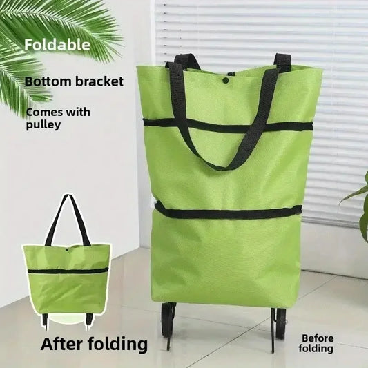 Foldable portable shopping cart with wheels being used outdoors as a lightweight hand cart for grocery and home shopping.